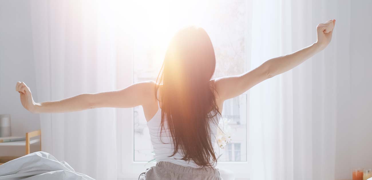 A woman stretching on a sunny morning