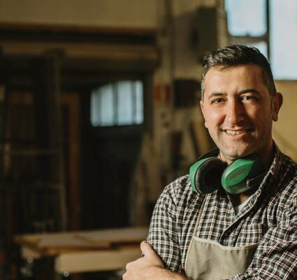 Master Craftsman smiling at camera